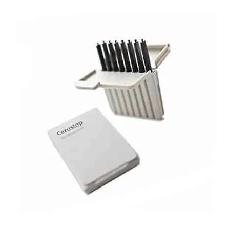 White plastic holder carrying a row of black-tipped rods, set behind a white sleeve labelled Cerustop.
