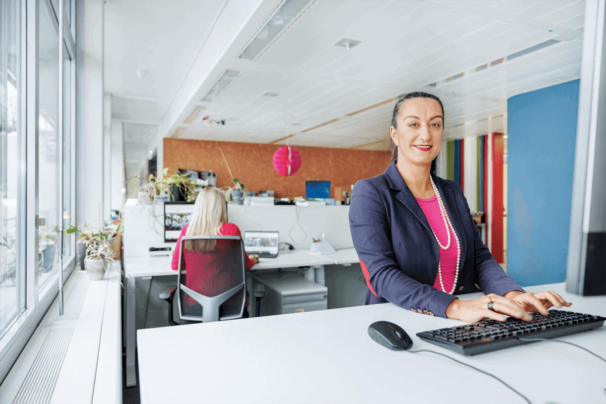 Woman with hearing loss at computer